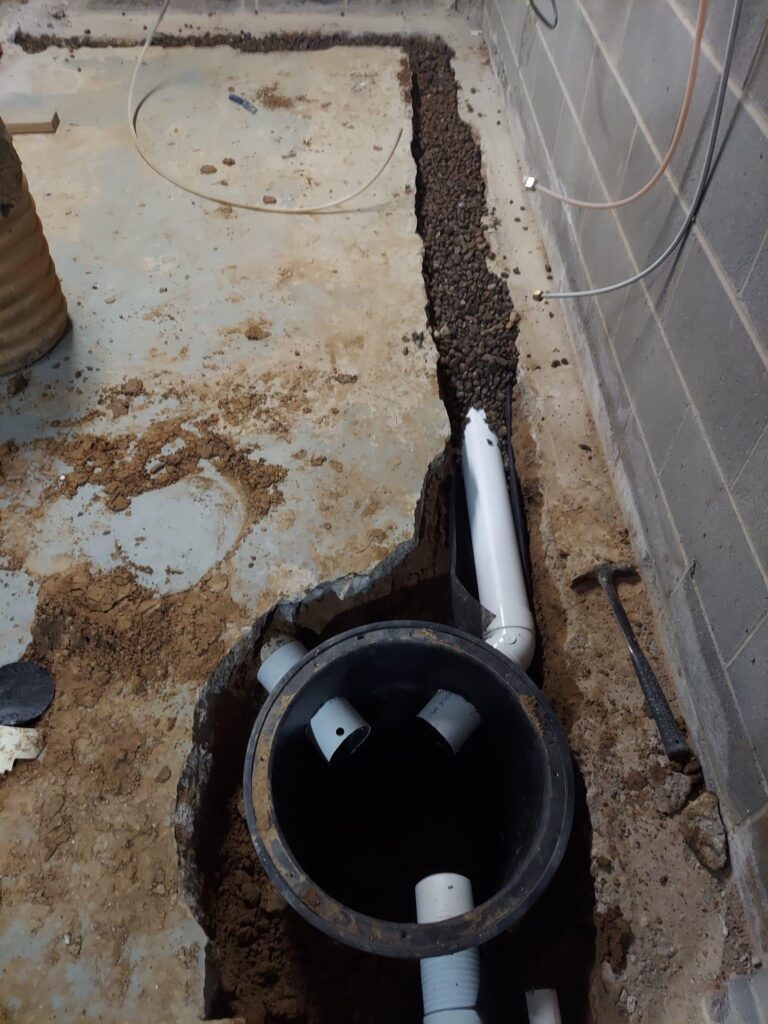 A French Drain takes the water to a catch basin called a Sump crock