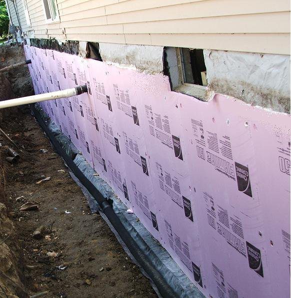 Putting up siding in foundation repair