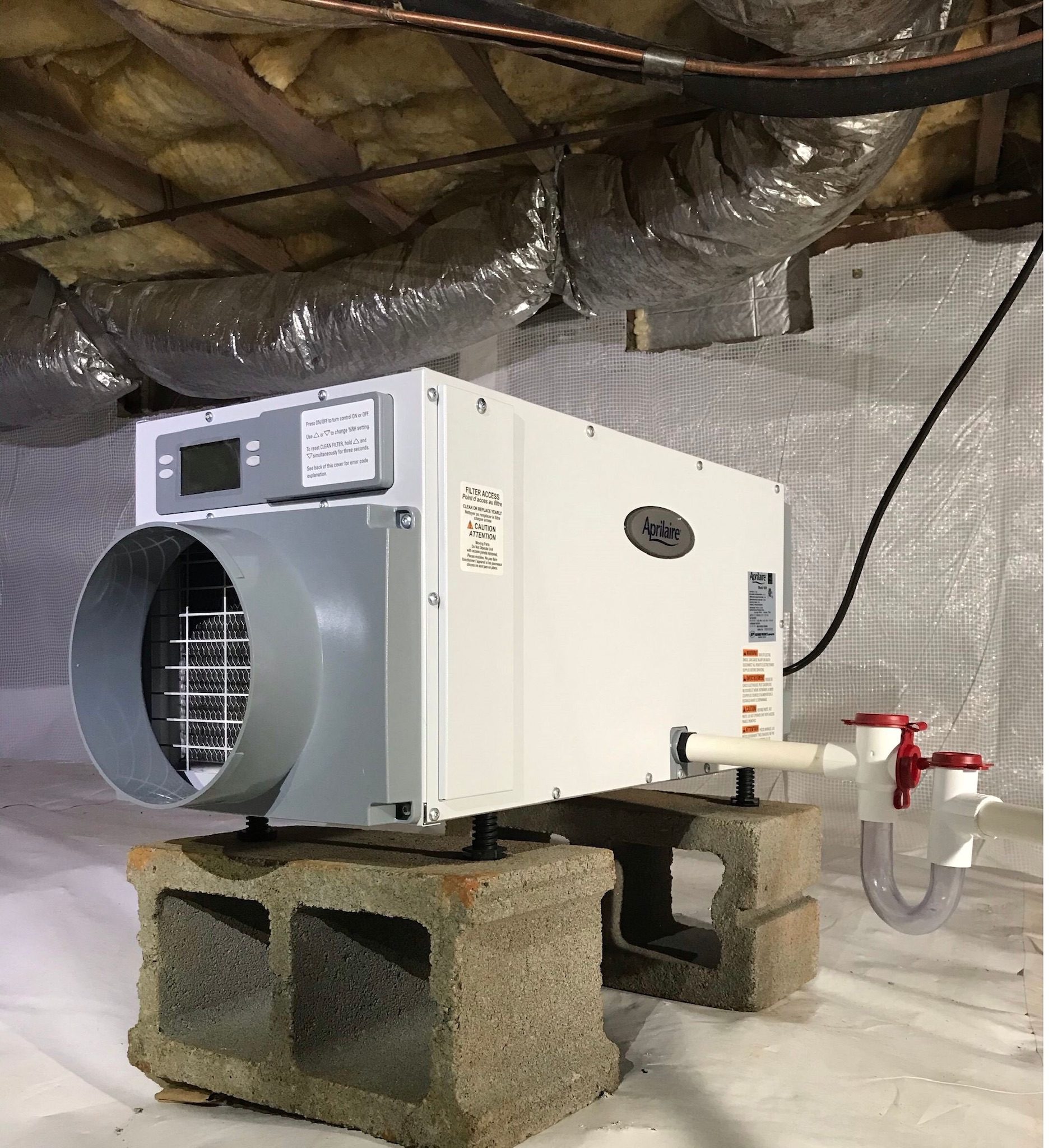 An Aprilaire dehumidifier installed by StayDry Waterproofing in a customer's crawl space.